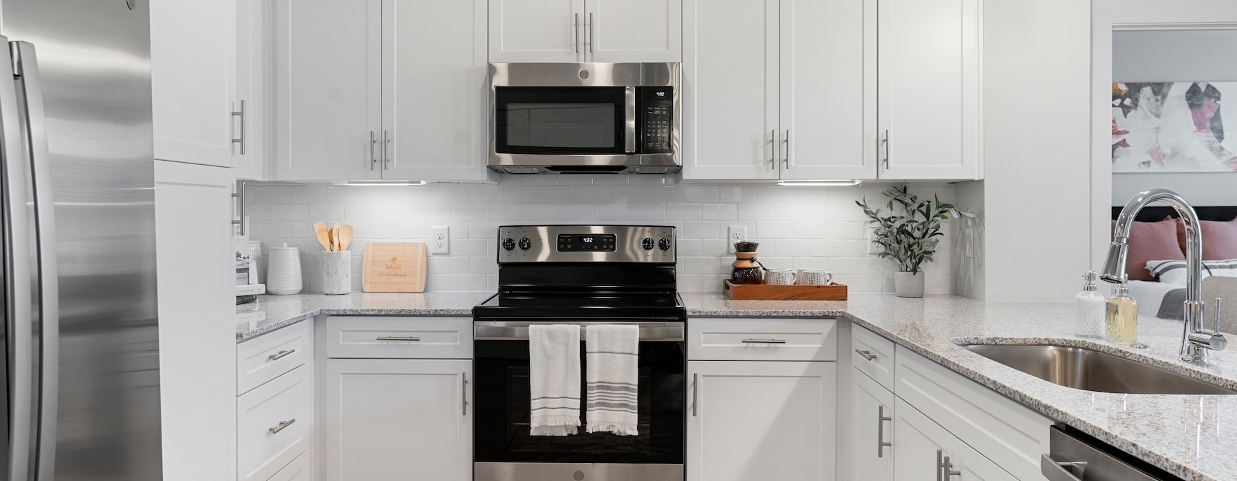 a kitchen with white cabinets
