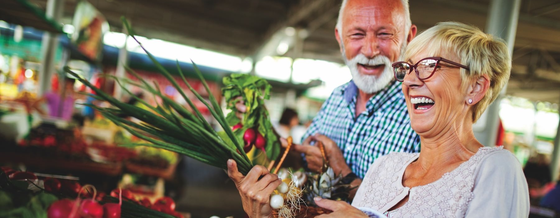 a man and woman holding flowers